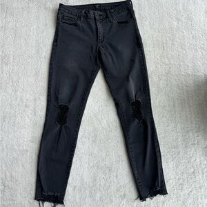 Black distressed super stretchy denim. The most comfortable jeans I’ve ever worn